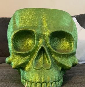 large glittery green skull holder